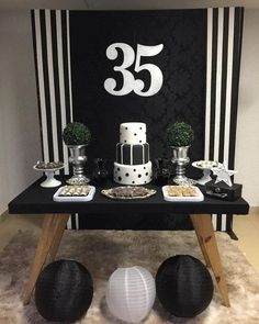 a table with black and white decorations on it