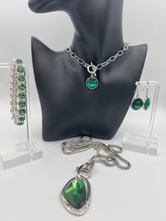 Mix and match. Instant collection.  Can't resist beautiful, emerald toned jewelry? Well, you don't have to!  Assorted pieces of emerald tone jewelry with silver tone metal bases.   One necklace (approximately 16") and a pair of earrings are a set. The bracelet and the longer necklace (approximately 20") are complementary to each other. All in good condition. Please review the photos carefully as they are an important part of the description. Green Nickel-free Costume Jewelry, Wedding Jewellery, Stretchy Bracelets, Wedding Jewelry Sets, Long Necklace, Jewelry Sets, Wedding Jewelry, Silver Tone, Emerald