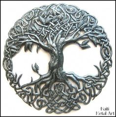 an intricate metal tree of life brooch