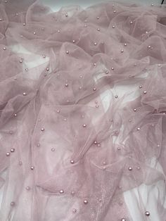 pink tulle with pearls on the bottom