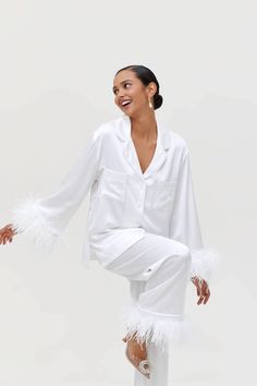 White Bridal Pajamas set, Bride Pajama Set With Feather, Feather Pajamas, Wedding Satin Pajamas, Bridal Pajama with Long Pants for Gift Your dreams will be like never before! These luxurious pajamas made of premium satin not only look beautiful, they have the incredible ability to give the most comfortable sleep to their owners. * Loose fit * Long sleeved shirt with buttons at the front slips below the hips  * Shirt with buttons and chest pocket * Pants with elastic waistband Shipping: * Free sh White Long Sleeve Sets For Wedding Night, White Long Sleeve Sets For Wedding, Feather Bride Pajamas, White Feather Bridal Pajamas, Feather Pajama Set, Satin Pajamas Set With Feathers, Pajama With Feathers, Elegant White Bedtime Set, Bride Pajama