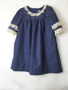 This dress is Royal Blue fabric, with Ecru lace on the neckline and sleeves.  The sleeves are three quarters, making it good for fall, winter or spring. The dress is 100% cotton, however, it wrinkles minimally.  The dress is lined in white poly/cotton fabric. Care instructions are to wash and tumble dry.  Remove from dryer as soon as possible.  If desired, press on cotton with steam setting.  All fabrics have been pre-shrunk. The dress has a 2 1/2" double hem and french seams for a finished touc Royal Blue Fabric, French Seam, Dress Measurements, Blue Fabric, Three Quarter, Cotton Dresses, Wrinkles, Fabric Care, Royal Blue