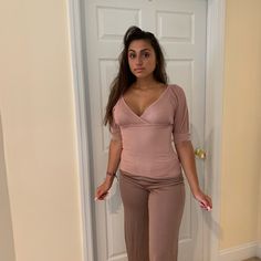 2pc Set Includes Top With V-Neck And Wide Leg Trouser. The Model Is 5/6inches. V-neck Sets For Night Out In Spring, Spring Season V-neck Sets For Night Out, Spring V-neck Sets For Night Out, Fitted V-neck Sets, Spring Stretch V-neck Top For Loungewear, Stretch V-neck Sets For Workwear, Stretch V-neck Workwear Sets, Fitted V-neck Loungewear Sets, Pink V-neck Set For Work