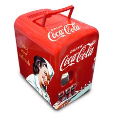 an old fashioned coca - cola cooler with a woman's face painted on it