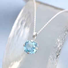 Topaz Solitaire Pendant - A stone of delightful light Swiss blue colour and clarity. It is set in a sturdy sterling silver bail with sterling silver necklace. chain. * Stone: Swiss Blue Topaz, 12mm cushion cut * Sterling silver * December birthstone - December Birthday pendant * Boxed, ready for gifting * Supplied with sterling silver diamond cut adjustable chain 18-20"/45-50cm You will receive a pendant like the one in the photograph, colour may vary slightly We have one for immediate dispatch. Swiss Blue Topaz Necklace, Birthday Pendant, December Birthstone Jewelry, Peridot Pendant, Blue Topaz Necklace, Topaz Jewelry, Jewellery Gifts, Topaz Necklace, August Birthstone