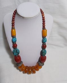 Vintage Tibet Multicolour faux beads necklace L60cm W126g Material: faux beads such as amber beads, turquoise beads and coral beads, nut beads Size: 60cm,  Weight: 126g Colour:  yellow, red, green, silver Remark: Item as the pictures show, Sold as it was. if you have any question, please  send me message, I would like to answer you question without hesitation. Item will be shipped out in 1 business day. Amber Beads, Colour Yellow, Plastic Resin, Coral Beads, Beads Necklace, Turquoise Beads, Tibet, Chain Styles, Red Green