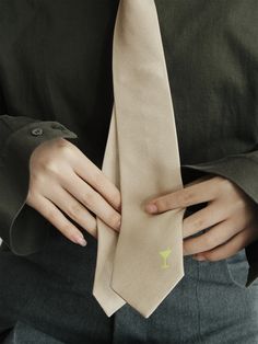 Elevate your style with Lost Pattern's exquisite silk tie, perfect for both women and men. This sophisticated accessory is designed to add a touch of flare and personality to any outfit. Handcrafted from the finest silk and adorned with delicate embroidery of martini glass, this silk tie showcases a playful yet elegant design. This subtle detail adds a charming twist to your look, making a statement of individuality and style. Product Information: 100% silk tie for men & women 57" x 2. 8" (146x7cm) Embroidery Gifting perfect box included Dry clean Only Classic Suit And Tie Accessories For Spring Workwear, Classic Tie For Semi-formal Spring Occasions, Classic Semi-formal Ties For Spring, Classic Ties For Semi-formal Spring Occasions, Elegant Fitted Neckwear For Spring, Dapper Standard Tie Neckwear, Dapper Standard Tie For Work, Silk Ties For Work, Classic Formal Neckwear For Spring