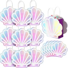 a set of six pastel mermaid shell shaped paper clips with matching tags and gift bag