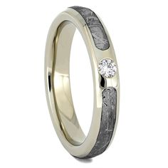 a wedding ring with two diamonds on it