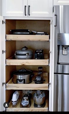 an open pantry with pots and pans