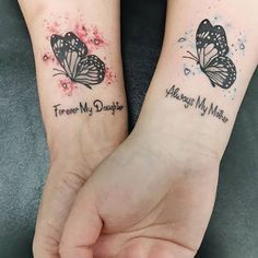 two matching tattoos with butterflies on their arms that say i love my daughter and mommy