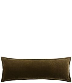 an olive green velvet pillow on a white background