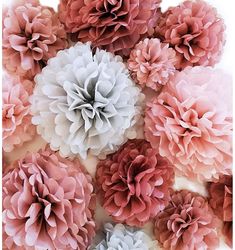 a bunch of pink and grey flowers on a white background