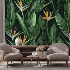 two chairs and a table in front of a tropical wall mural