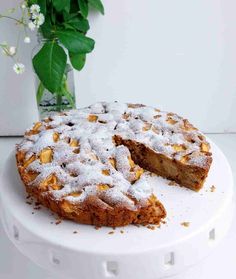 a cake on a plate with one slice cut out