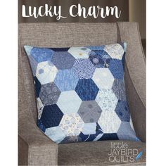 a chair with a pillow on it and the words lucky charm written in front of it