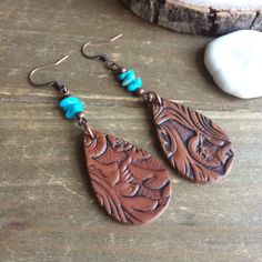 Sleeping beauty earrings turqouise blue leather earrings carved boho earrings handmade copper dangle gift stone unique jewelry for women SLD These beauties, I used 6-8mm sleeping beauty turquoise from the Kingman mine mountain, hand carved leather brown lightweight teardrop engraved handmade beads, copper findings and ear Wires. This comes from the mine in Kingman, AZ. We used to have many of them but they've been more productive of copper late, so they've been switching, in fact the sleeping be Hand Tooled Teardrop Bohemian Earrings, Bohemian Teardrop Hand Tooled Earrings, Bohemian Hand Tooled Teardrop Earrings, Adjustable Copper Teardrop Bohemian Earrings, Kingman Az, Stone Dangle Earrings, Real Turquoise, Earrings Turquoise, Beaded Anklets