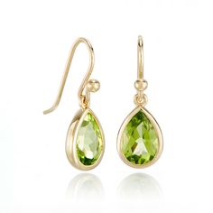 Earrings made to gently sway as you move, our lovely teardrop earrings showcase the fresh yellow-green hue of peridots. Since 1861, Gump's has been a destination for jewelry that is distinctive and timeless. To ensure each piece is created to our exacting standards, our expert in-house jewelry team oversees every step of the production process. The result is a statement of pure elegance. Peridots, 3.80ctw. 14-karat yellow gold. Pierced only. 7/8" long. Teardrop May Birthstone Earrings, Classic Green Peridot Earrings, Elegant Lime Green Dangle Earrings, Classic Teardrop Earrings For May Birthstone, Classic Teardrop May Birthstone Earrings, Yellow Gold Pear-shaped May Birthstone Earrings, Teardrop Peridot Earrings For May Birthstone, Peridot Teardrop Earrings For May Birthstone, Yellow Gold Peridot Teardrop Jewelry