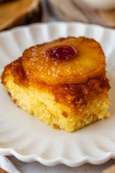 a piece of pineapple upside down cake on a white plate