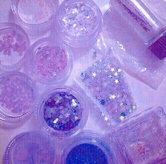 there are many different colored glitters in the containers