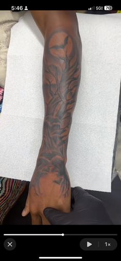 a person with tattoos on their arm and leg