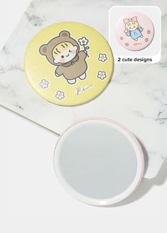 a white plate with a brown bear on it next to a cup and saucer