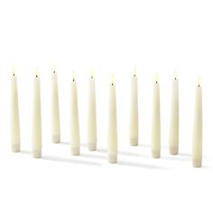 eight candles lined up in a row on a white background, with one candle turned upside down