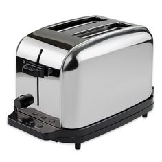 a silver toaster sitting on top of a white table next to a black handle