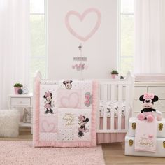 The Disney Minnie Mouse My Happy Place 3 Piece Crib Bedding Set Includes a comforter, fitted crib sheet, and crib skirt. Features a happy Minnie Mouse with ruffles, hearts, and bows! Designed in shades of light pink, black, gray, and white, with sweet gold metallic appliqued words, You're My Happy Place! Reverses to a playful pattern of Minnie Mouse and hearts. The comforter measures 36" x 45". The 100% cotton fitted crib sheet is a fun allover pattern of Minnie Mouse, hearts, and bows, with wor Minnie Mouse Nursery, Disney Baby Nurseries, Disney Themed Nursery, Baby Room Themes, Disney Nursery, Baby Minnie Mouse, Nursery Crib, Girls Nursery, Nursery Baby Room