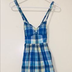 Description: Criss Cross Back, Side Pockets Condition: Brand New With Tag Blue Sleeveless Mini Dress For Picnic, Blue Sleeveless Cotton Mini Dress, Blue Cotton Mini Dress For Picnic, Blue Sleeveless Dress For Picnic, Blue Cotton Picnic Dress, Blue Cotton Sundress For Day Out, Blue Cotton Dress For Picnic, Casual Blue Mini Dress For Daywear, Blue Mini Dress For Summer Picnic