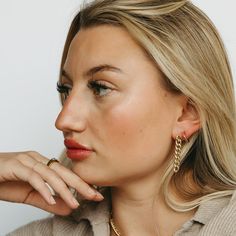 If you’re looking for a bold, statement-making earring that won’t break the bank, then this is it. With its 18k gold-filled Cuban link chain and drop style stud design, our Tatum Chain Link Earring is the perfect way to add some sass and glamor to your outfit. Wear them with jeans and t-shirt or dress them up with a cocktail dress and heels-no matter how you wear them, they’ll be sure to turn heads! Modern Chain Link Earrings For Everyday Wear, Dangle Hoop Earrings With Cable Chain, Everyday Link Jewelry For Pierced Ears, Everyday Dangle Chain Earrings, Yellow Gold Chain Earrings For Everyday, Trendy Drop Earrings With Chain Detail, Trendy Chain Link Earrings For Everyday, Trendy Everyday Chain Link Earrings, Everyday Yellow Gold Chain Earrings