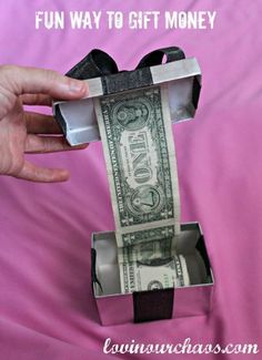 a person holding a money bill in a box with the words fun way to gift money