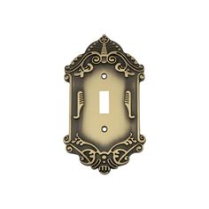 an ornate light switch plate cover in antique brass with intricate designs on the front and sides