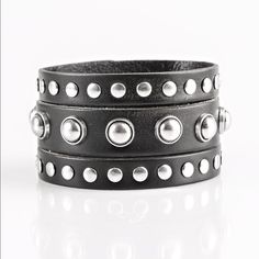 Win Your Spurs - Black Round And Flat Silver Studs Are Studded Across The Front Of A Thick Black Leather Band That Has Been Spliced Into Three Bands. Features An Adjustable Snap Closure. Sold As One Individual Bracelet. Punk Black Bracelet With Silver Studs, Silver Punk Bracelets With Studs, Punk Style Silver Bracelet With Studs, Silver Leather Punk Bracelet With Black Band, Punk Style Silver Leather Bracelet With Black Band, Silver Leather Bracelet With Black Band In Punk Style, Edgy Silver Bracelet With Black Band, Edgy Silver Bracelets With Black Band, Edgy Silver Leather Bracelet With Studs