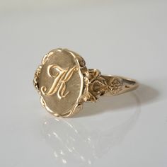 This vintage style signet ring is inspired by 17th-century Italian Baroque architecture, featuring beautiful little fluorishes all around the center which displays your personal monogram or initials. This ring can be customized with any letter or word (provided it fits) and is made in solid gold. This ring can be made for men or women and in your preferred size or color of gold. A phrase or letter may be written on the inside, too! All designs are modelled and sent to you for approval before cas Heirloom Yellow Gold Initial Ring With Engraving Option, Heirloom Initial Ring In Yellow Gold With Engraving Option, Victorian Wedding Signet Ring With Intricate Design, Heirloom 14k Gold Initial Ring With Engraving Option, Heirloom Monogram Signet Ring For Anniversary, Heirloom Yellow Gold Engraved Initial Ring, Heirloom Engraved Initial Ring In Yellow Gold, Heirloom Wedding Signet Ring With Intricate Design, Heirloom 14k Gold Engraved Ring With Monogram