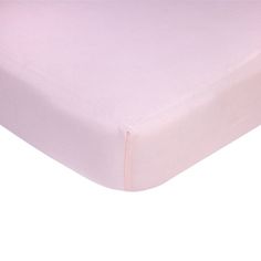 a pink sheet that is on top of a white bedding set with no sheets