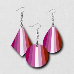 Express your pride, style and make a statement with our beautiful and fashionable unique LGBTQ earrings. Our hardboard wood earrings have a vibrant image printed on both sides. Want a custom flag, let us know.Be sure to check out the other items in our LGBTQ Pride collection! Earrings are hypoallergenic and lightweight with a glossy finish. Fishhooks are made of Zinc Alloy.Choose from teardrop, round or diamond shape to match your fashion, mood, style or outfit! Makes a perfect gift for someone Lgbtq Earrings, Lgbtq Flag, Mood Style, Pride Collection, Lgbtq Flags, Custom Flags, Lgbtq Pride, Wood Earrings, Diamond Shape