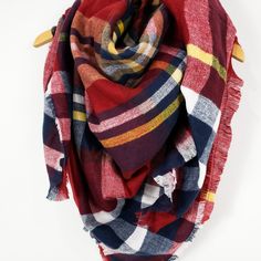 PRETTY PLAID || SCARF LOVE Tartan plaid scarf with red, blue, yellow, and white colored shades Super soft, knit, medium weight fabric Raw fringe edge Available in 6 colors 100% Acrylic Measurements approximately 57" X 57" Machine wash cold gentle cycle, hang to dry, or dry clean Red Casual Scarves For Fall, Casual Red Scarf For Fall, Fall Plaid Shawl Scarf, Plaid Shawl Scarf For Fall, Winter Plaid Scarves One Size, Plaid Winter Scarves One Size, Red Shawl Scarves For Fall, Cotton Shawl Scarves For Fall, Tartan Plaid Scarf