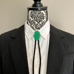 This is light green marblized glass bolo. It comes with a black cotton tie with silver toned tips. Vintage Adjustable Bolo Tie For Formal Occasions, Adjustable Elegant Bolo Ties For Formal Occasions, Elegant Adjustable Bolo Ties For Formal Occasions, Adjustable Western Bolo Tie For Formal Occasions, Black Adjustable Bolo Tie For Formal Occasions, Black Western Style Formal Jewelry, Elegant Adjustable Bolo Tie As A Gift, Formal Adjustable Green Jewelry, Bolo Ties