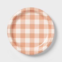 an orange and white checkered paper plate