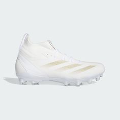 the adidas soccer cleats are white and gold, with metallic detailing on the upper