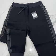 Mcm Straight Pants, Color: Black, They Are Perfect For A Casual Sporty Look, They Go As Straight Pants But In The Bottom They Look Like Joggers As You Can Tell In The Pictures. Black Sporty Sweatpants With Logo Waistband, Sporty Black Sweatpants With Logo Waistband, Casual Black Pants With Logo Waistband, Black Athleisure Pants With Logo Waistband, Casual Black Bottoms With Logo Waistband, Designer Black Straight Leg Pants, Black Athleisure Bottoms With Tapered Leg, Black Tapered Leg Athleisure Bottoms, Luxury Black Straight Leg Pants