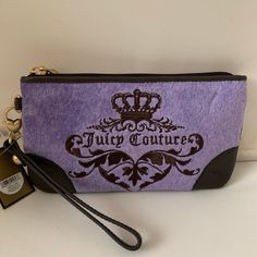 Juicy Couture Heather Violet Velour Wristlet *New With Tags *Heather Violet Velour Exterior *Front: Embroidered Juicy Couture And Crown Detail *Back: Mahogany Leather "J" Patch *Brown/Lavender Juicy Couture Printed Canvas Interior *Interior: (3) Card Slots *Top Zip Closure, Burnished Gold-Tone Hardware *Detachable Mahogany Leather Wrist Strap *Approximate Dimensions: 7" X 3.75" Purple Pouch Wristlet Gift, Purple Pouch Wristlet As Gift, Purple Clutch Wristlet For Everyday Use, Purple Everyday Pouch Wristlet, Trendy Purple Pouch Clutch, Purple Pouch Wristlet For Everyday Use, Trendy Purple Clutch As A Gift, Purple Rectangular Wristlet For Travel, Trendy Purple Clutch For Daily Use