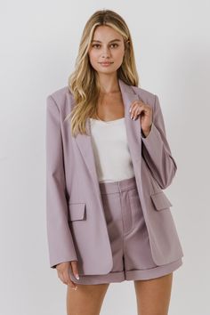 This Single Breasted Blazer is perfect for dressing up or dressing down any outfit. With its versatile style, it can be worn to the office or out on a casual day. Matching shorts available to complete the look. Button closure Long sleeve Pockets Lined Matching set of shorts sold separately Shell: 75% Polyester 25% Rayon Lining: 100% Polyester Style# JJ896J Size on Model: S Model Measurements: Height 5’10”(178cm) / Bust 32”(81cm) / Waist 25”(67cm) / Hip 35”(89cm) Measurements from size S: Total l Purple Blazer, Best Blazer, Single Breasted Blazer, Tailored Shorts, Pink Blazer, Blazer And Shorts, Magnetism, Breasted Blazer, Jacket Buttons