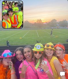 a group of young people wearing neon colored hats and vests on a soccer field