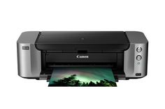 a canon printer with an image of the northern lights