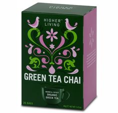 a box of green tea chai with pink and green designs on the side, sitting in front of a white background