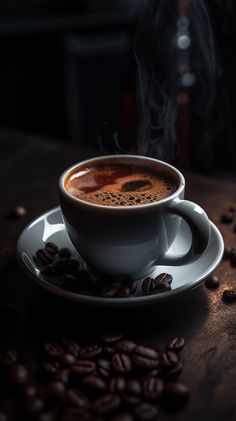 a cup of coffee sitting on top of a saucer next to some coffee beans