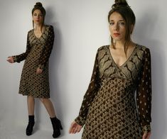 Vintage 90s silk Paul Ropp dress /  Brown long sleeve silk dress /  Size: size 3 (please check the measurements to make sure it will fit you). Model in the photos is size 8UK/4US; 164 cm/5'5'' Measurements, flat / approximate measurements: Overall length: 100 cm (39.37'') Bust: 45 cm x2 (17.71'' x2) The length of the sleeve (measured from the armpit): 46 cm (18.11'') Materials: silk. Good Vintage condition (spot in the back). Look at all the photos for a more detailed description. Due to camera and your monitor settings colors may appear slightly different than they are in real life. PLEASE read description. For better fitting I would suggest you compare measurements to a garment that you have in your closet to ensure a proper fit. No returns in case of the bad fit! SHIPPING: the item will Brown Silk Long Sleeve Dress, Vintage Fitted Long Sleeve Dress For Fall, Fitted Vintage Long Sleeve Dress For Fall, Vintage Long Sleeve Midi Dress For Party, Long Sleeve Silk Midi Dress For Fall, Fall Silk Midi Dress With Long Sleeves, Vintage Long Sleeve Silk Dress, Long Sleeve Vintage Silk Dress, Long Sleeve Silk Dress