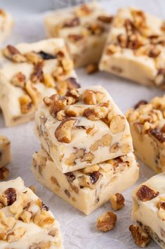 several pieces of white chocolate with nuts on top